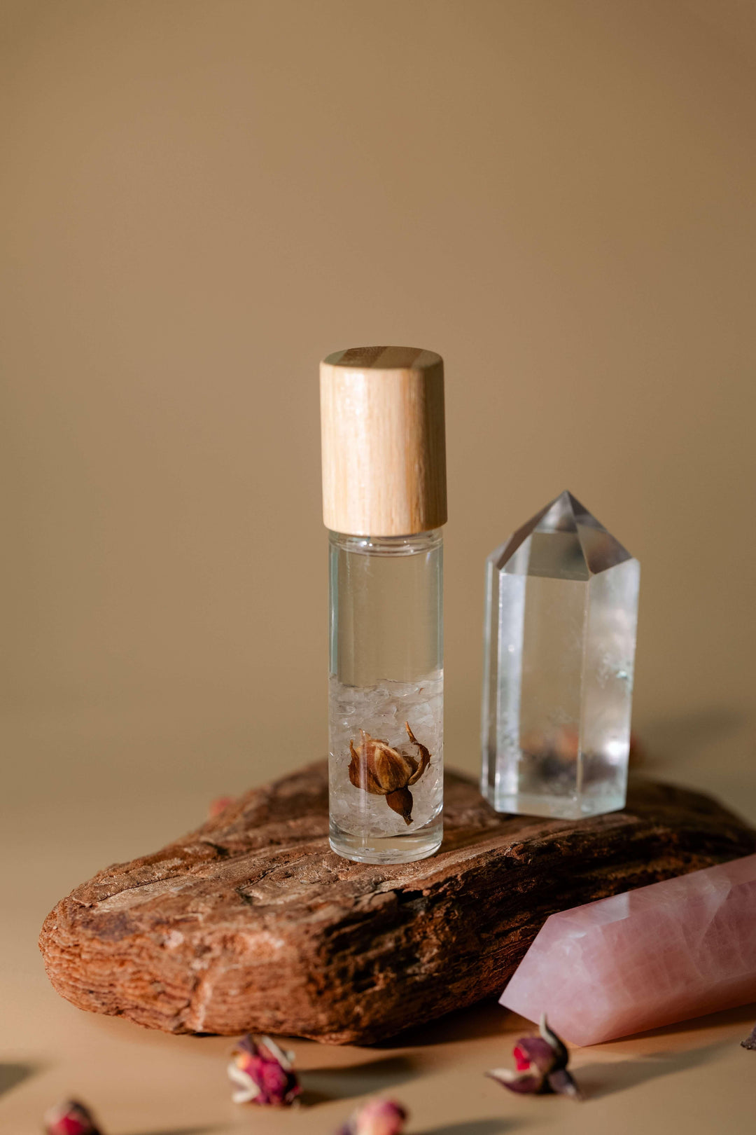 Sandalwood Rose Essential Oil Roller - on Stone with Crystals